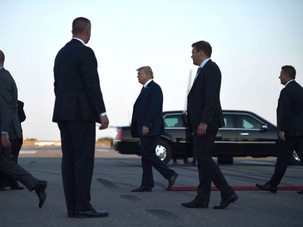 PHOTO: US President Donald Trump walks towards the Presidential car upon arrival at Helsinki-Vantaa Airport in Helsinki, July 15, 2018, on the eve of a summit in Helsinki between the US President and his Russian counterpart.