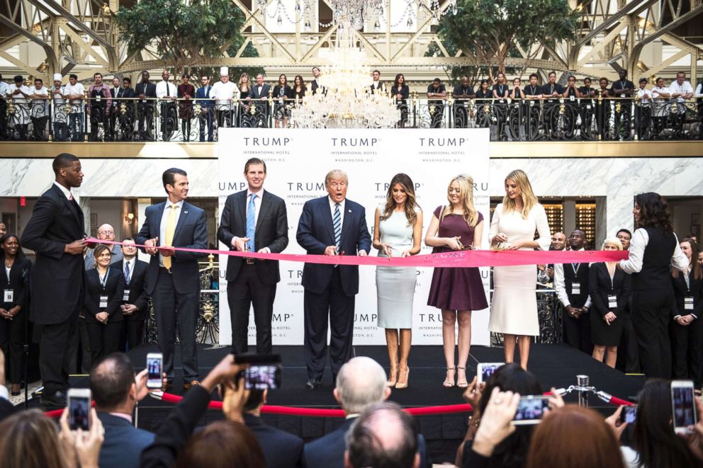 PHOTO: In this file photo, Donald Trump, accompanied by Donald Trump Jr., Eric Trump, Tiffany Trump, Melania Trump and Ivanka Trump, cut a ribbon during the grand opening ceremony of the Trump International Hotel in Washington, D.C., Oct. 26, 2016.