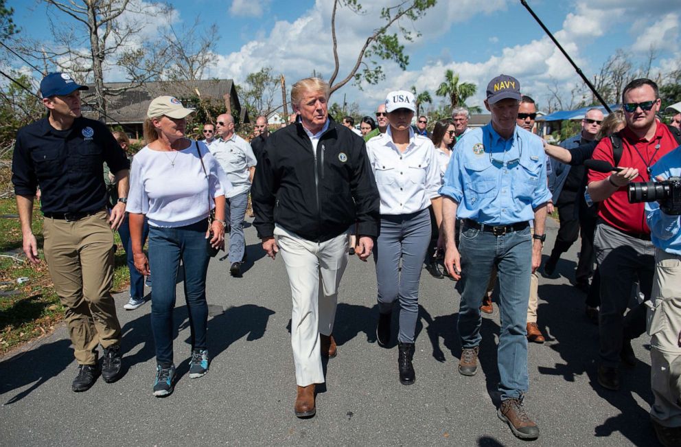 PHOTO: President Donald Trump, First Lady Melania Trump and Florida Governor Rick Scott, right, tour damage from Hurricane Michael in Lynn Haven, Florida, Oct. 15, 2018.