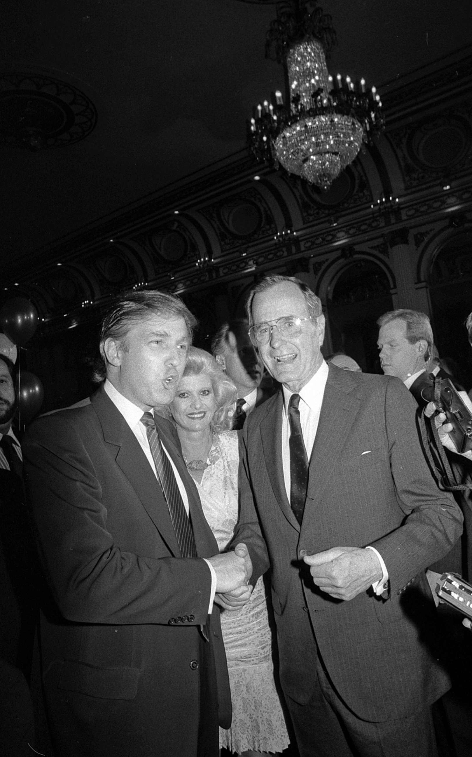 PHOTO: Donald Trump and his wife Ivana join Vice President George Bush in the ballroom of the  Plaza Hotel during a fundraiser for Mr. Bush's presidential campaign.