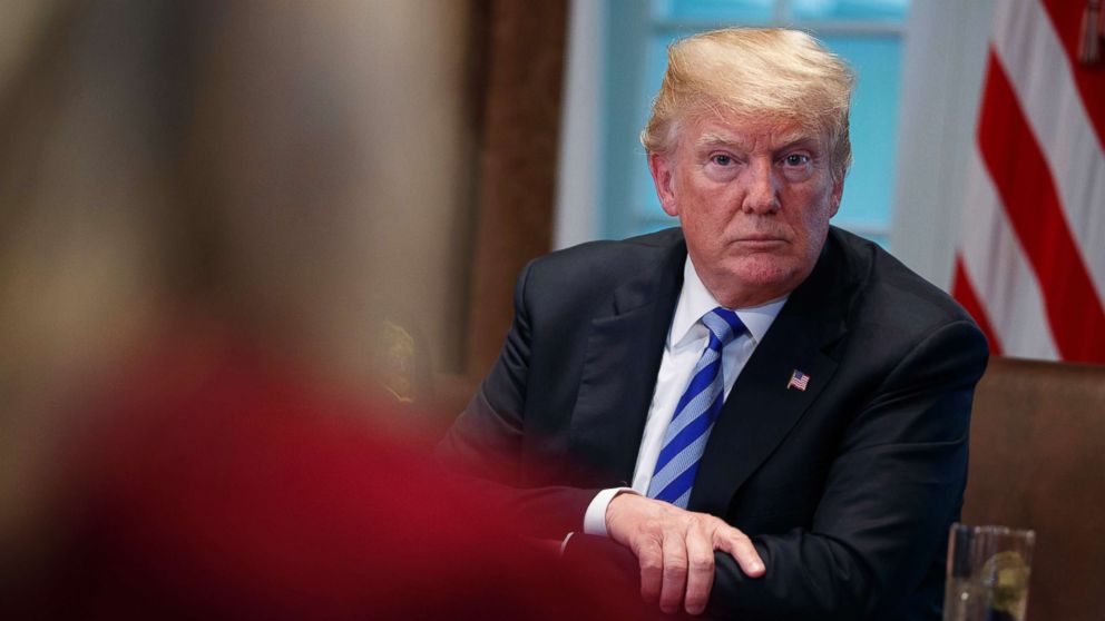 President Donald Trump listens during a round table on immigration policy in California in the Cabinet Room of the White House, May 16, 2018, in Washington.