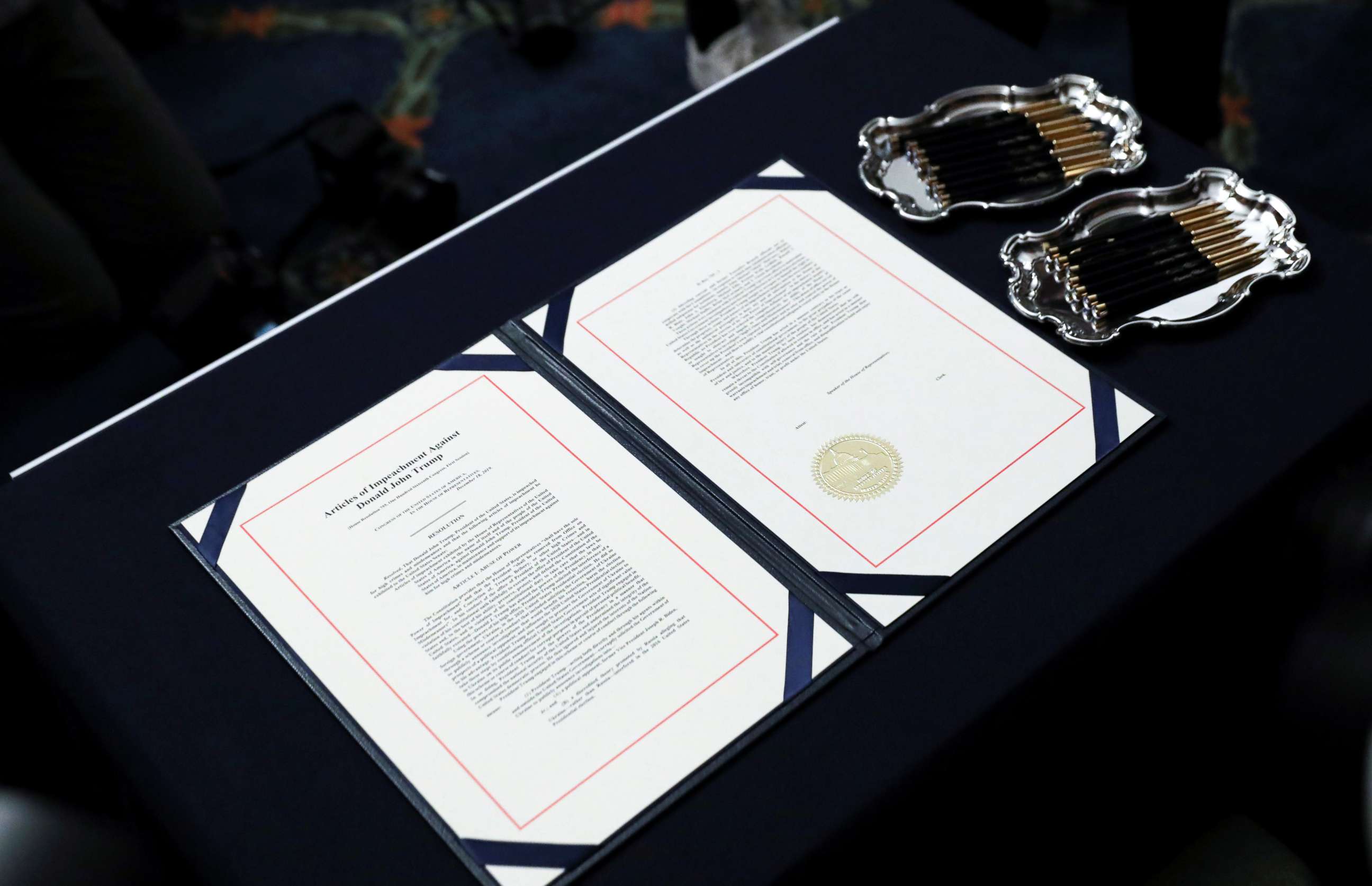 PHOTO: The two U.S House of Representatives articles of impeachment of President Donald Trump await the signature of House Speaker Nancy Pelosi before an engrossment ceremony at the U.S. Capitol in Washington, Jan. 15, 2020. 