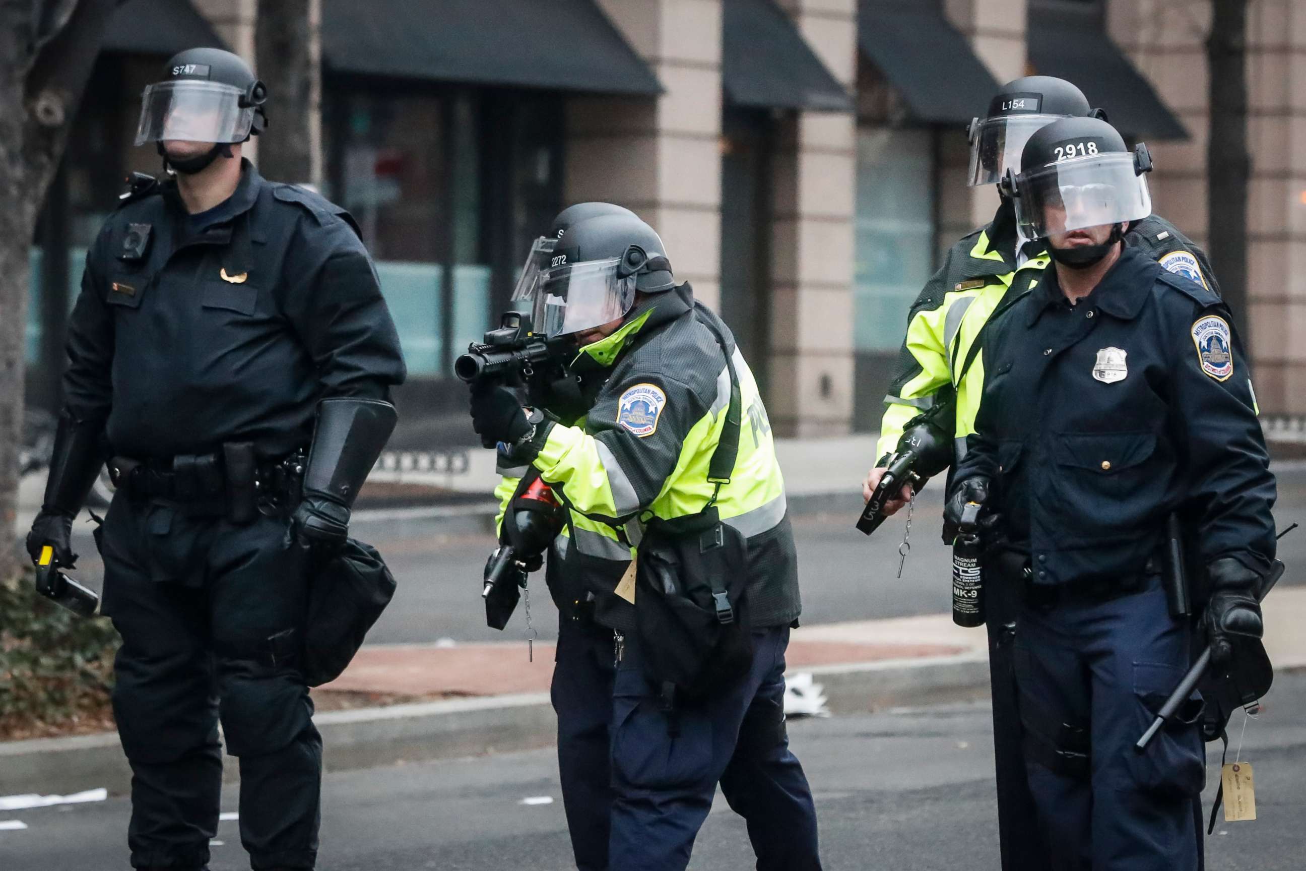PHOTO: A police officer prepares to fire a 'non-lethal' weapon at protesters during a demonstration after the inauguration of President Donald Trump, Jan. 20, 2017, in Washington, D.C.