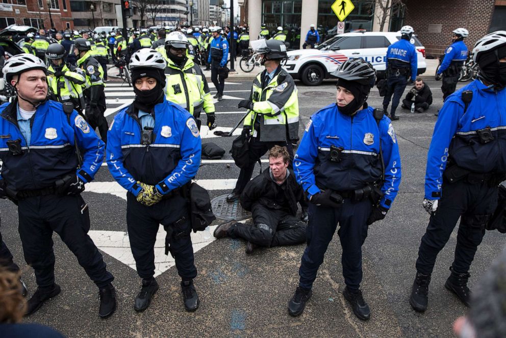 PHOTO: Police officers detain a protestor before the inauguration of President-elect Donald Trump on Jan. 20, 2017, in Washington, D.C.