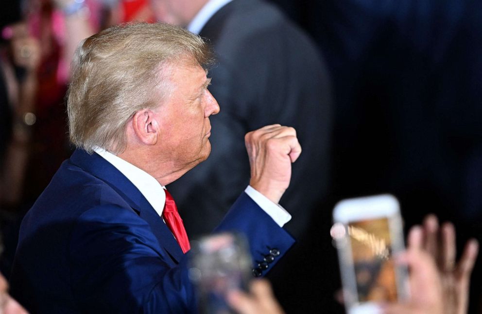PHOTO: Former President Donald Trump makes a fist as he arrives to speak during a press conference following his court appearance over an alleged 'hush-money' payment, at his Mar-a-Lago estate in Palm Beach, Fla., on April 4, 2023.