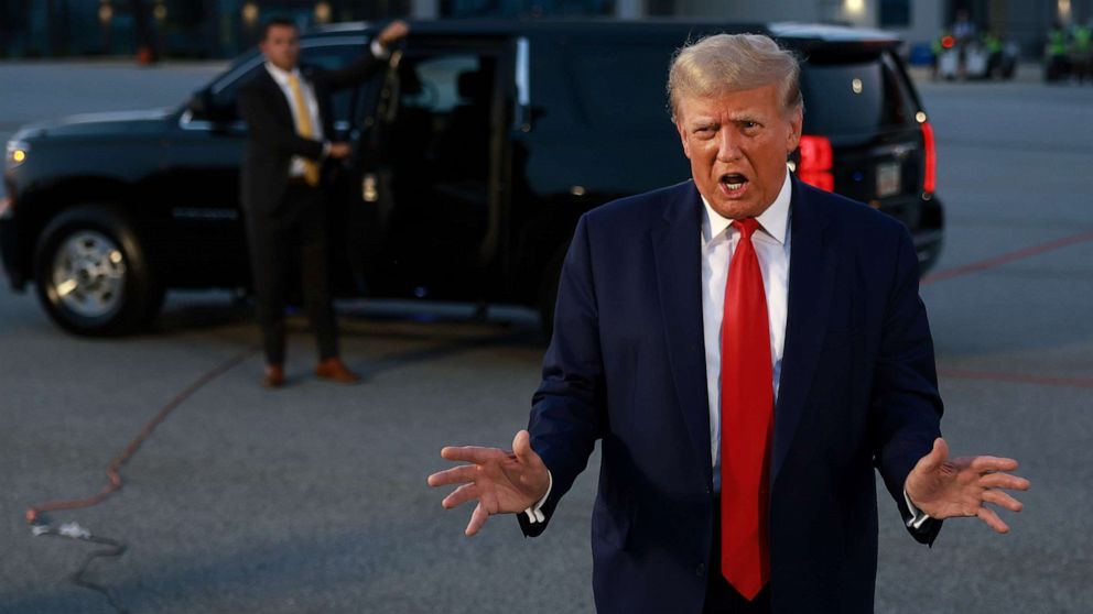 PHOTO: Former President Donald Trump speaks to the media at Atlanta Hartsfield-Jackson International Airport after surrendering at the Fulton County jail on Aug. 24, 2023 in Atlanta.