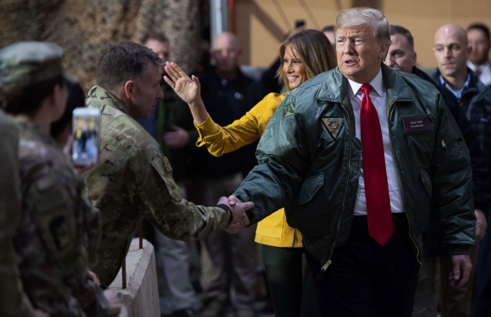 PHOTO: President Donald Trump and first lady Melania Trump arrive to speak to members of the U.S. military during an unannounced trip to Al Asad Air Base in Iraq on Dec. 26, 2018.