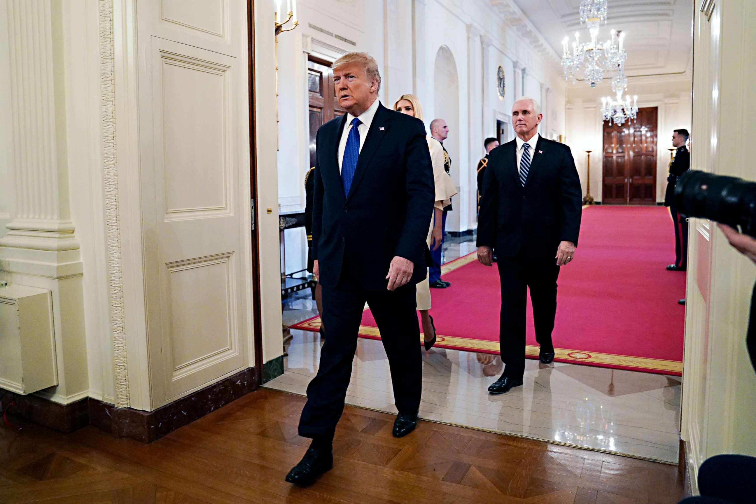 PHOTO: President Donald Trump arrives to speak during an event on human trafficking in the East Room of the White House on Jan. 31, 2020 in Washington, followed by Vice President Mike Pence, right, and senior adviser to the President, Ivanka Trump.