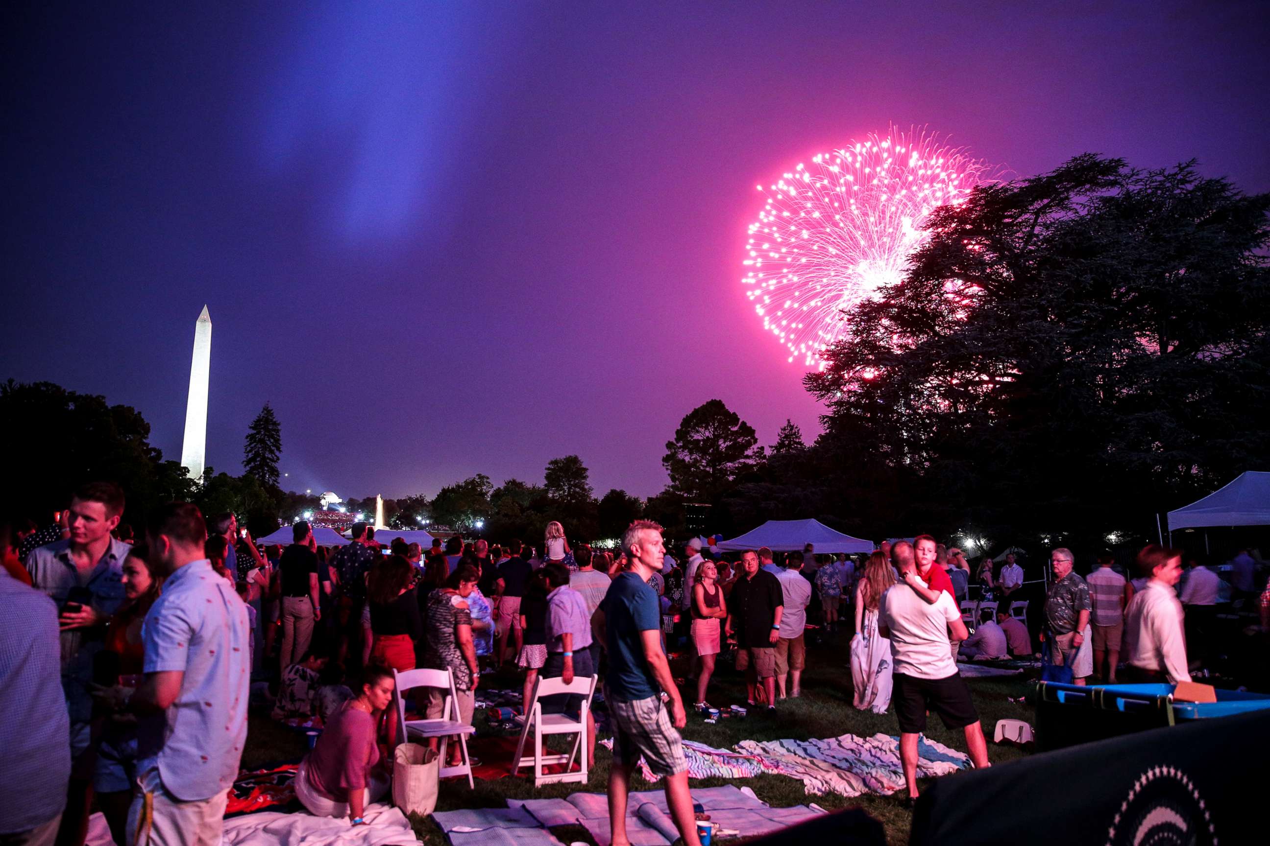 PHOTO: Guests watch a fireworks display on the South Lawn of the White House on July 4, 2018 in Washington, D.C.