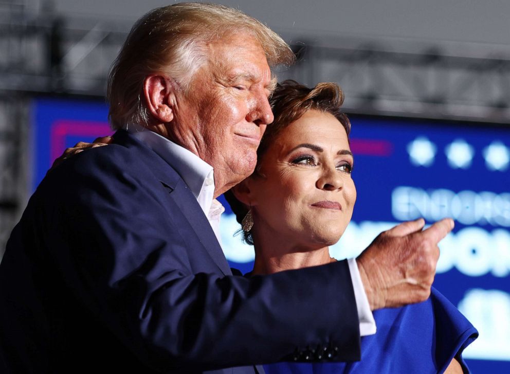 PHOTO: Former President Donald Trump embraces Arizona Republican candidate for governor Kari Lake, whom he has endorsed, during a campaign rally at Legacy Sports USA on Oct. 9, 2022 in Mesa, Arizona.