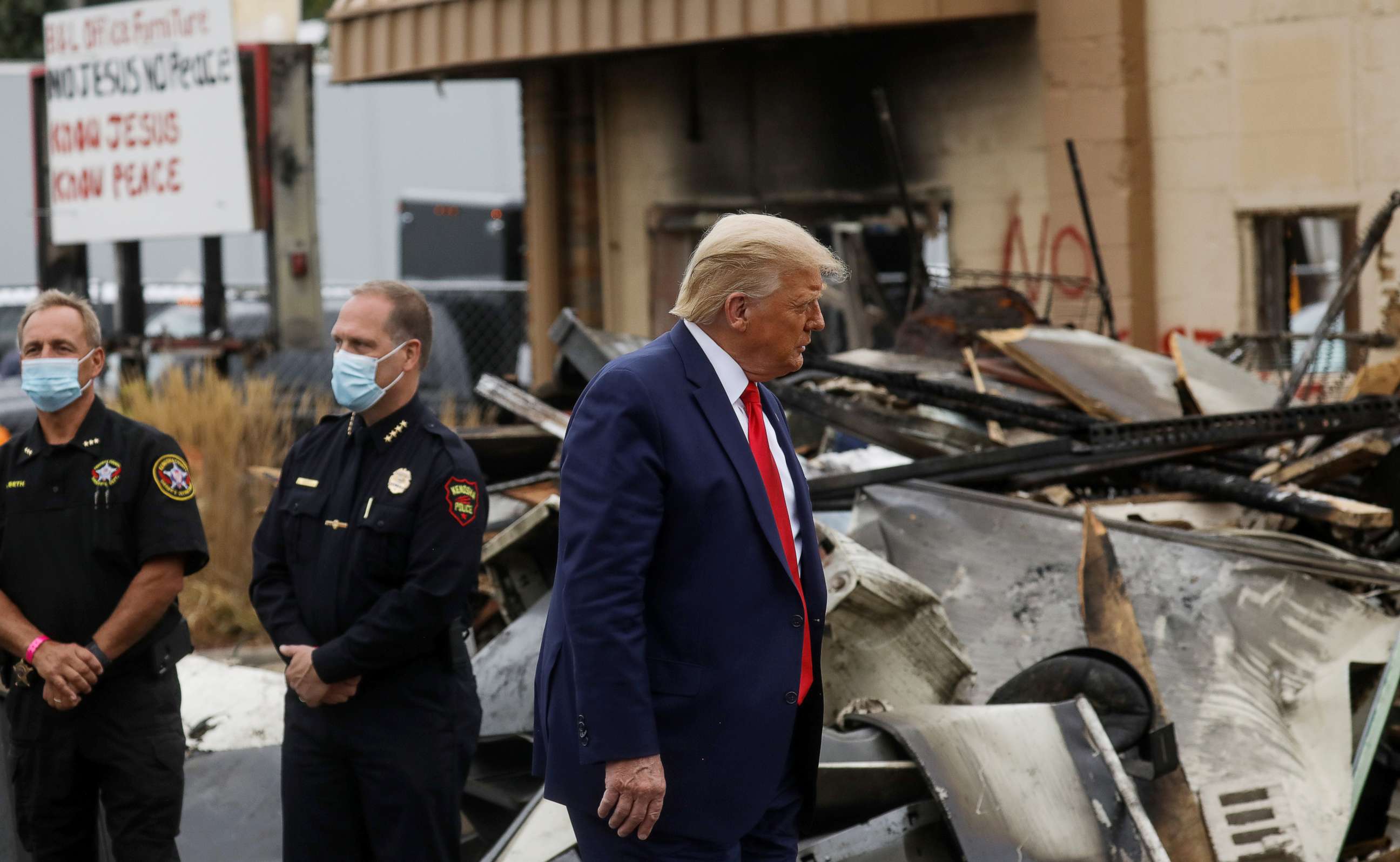 PHOTO: President Donald Trump views property damage during a visit in the aftermath of recent protests against police brutality and racial injustice in Kenosha, Wisconsin, Sept. 1, 2020.