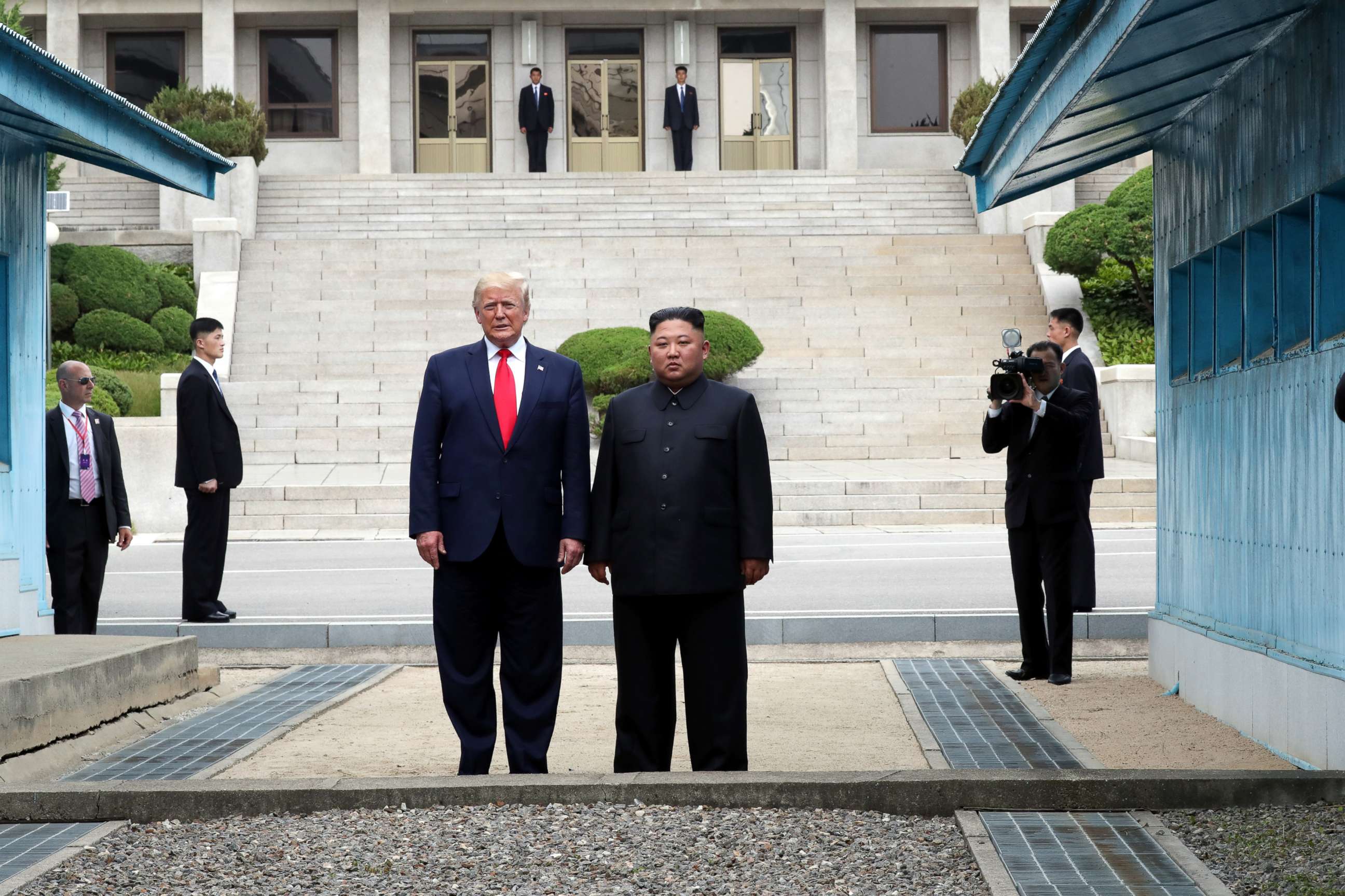 PHOTO: A handout photo provided by Dong-A Ilbo of North Korean leader Kim Jong Un and U.S. President Donald Trump inside the demilitarized zone (DMZ) separating the South and North Korea on June 30, 2019 in Panmunjom, South Korea.