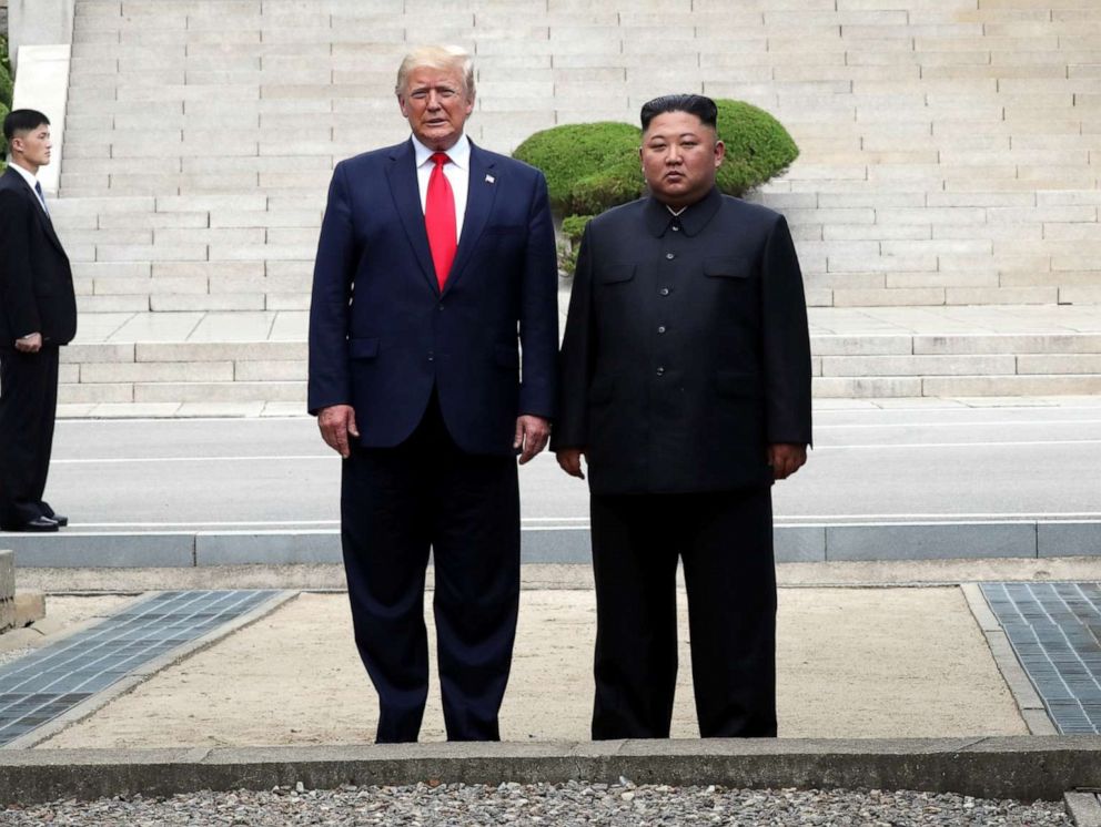 PHOTO: A handout photo provided by Dong-A Ilbo of North Korean leader Kim Jong Un and U.S. President Donald Trump inside the demilitarized zone (DMZ) separating the South and North Korea on June 30, 2019 in Panmunjom, South Korea.
