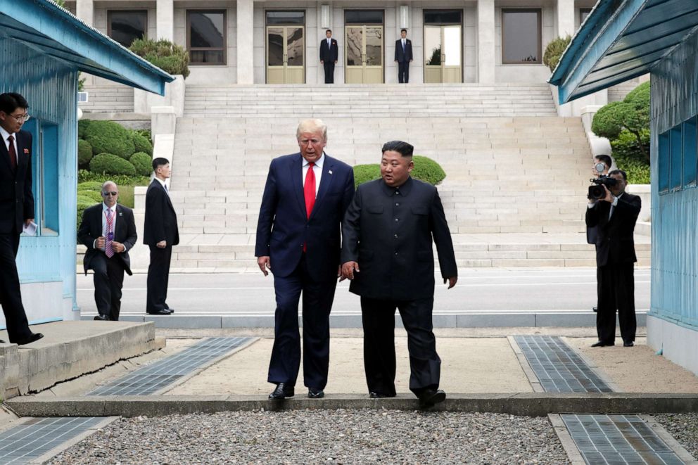 PHOTO: A handout photo provided by Dong-A Ilbo shows North Korean leader Kim Jong Un and U.S. President Donald Trump inside the demilitarized zone (DMZ) separating the South and North Korea, June 30, 2019, in Panmunjom, South Korea.