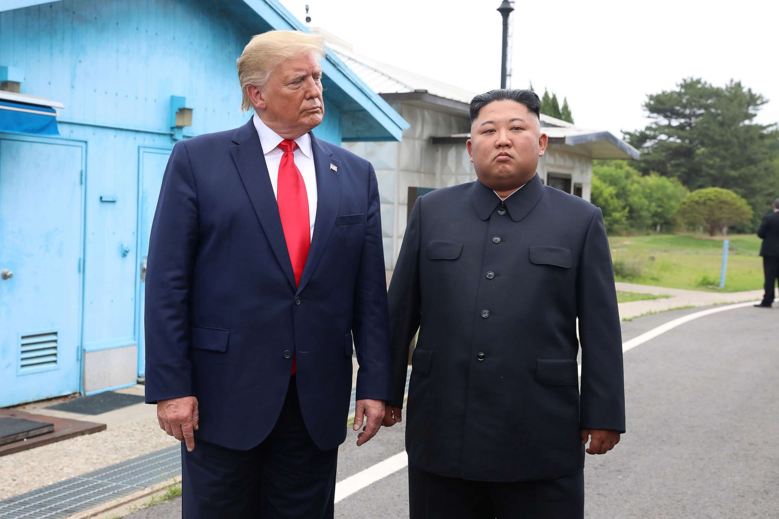 PHOTO: President Donald Trum and North Korean leader Kim Jong Un meet in the demilitarized zone (DMZ) separating the South and North Korea on June 30, 2019 in Panmunjom, South Korea.