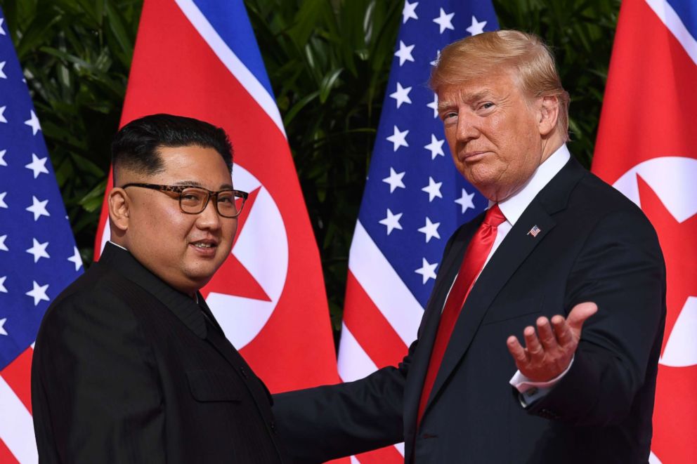 PHOTO: President Donald Trump gestures as he meets with North Korea's leader Kim Jong Un at the start of their historic US-North Korea summit, at the Capella Hotel on Sentosa island in Singapore, June 11, 2018.