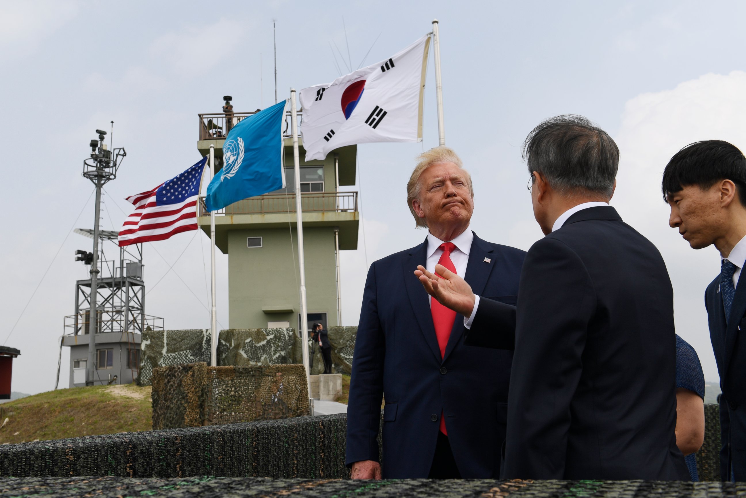 PHOTO: President Donald Trump talks with South Korean President Moon Jae-in and views North Korea from the Korean Demilitarized Zone from Observation Post Ouellette at Camp Bonifas in South Korea, Sunday, June 30, 2019.