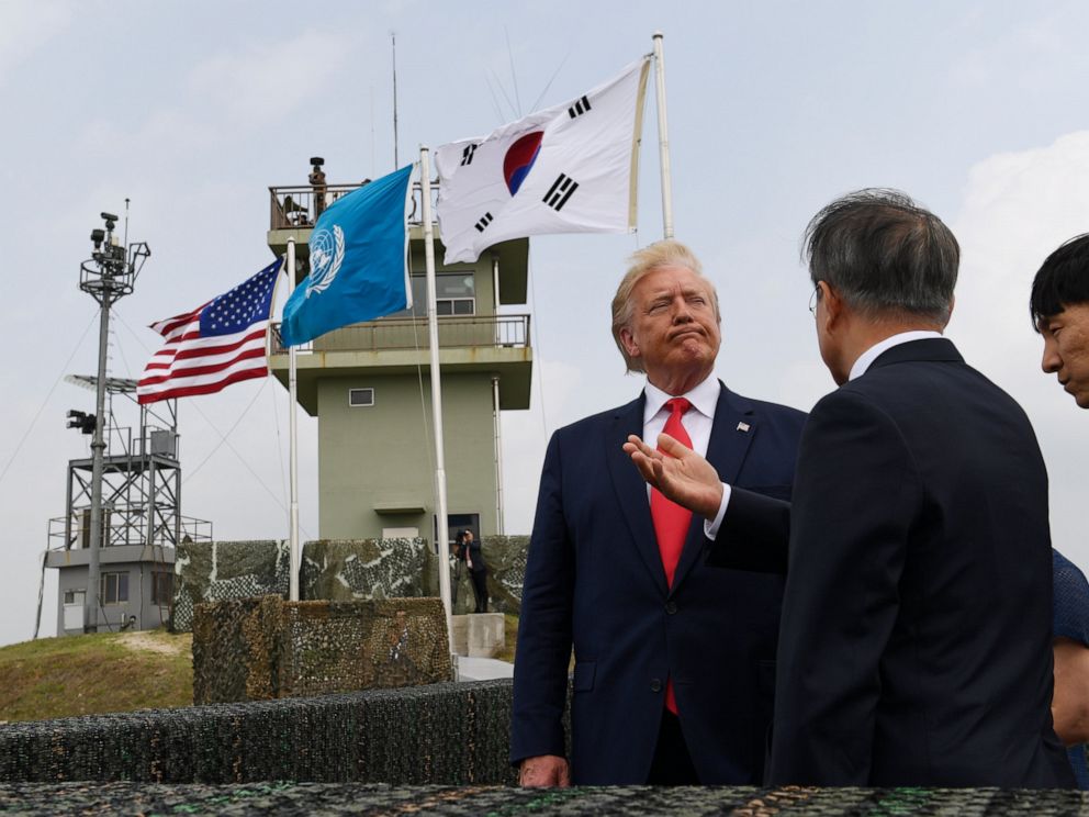 PHOTO: President Donald Trump talks with South Korean President Moon Jae-in and views North Korea from the Korean Demilitarized Zone from Observation Post Ouellette at Camp Bonifas in South Korea, Sunday, June 30, 2019.