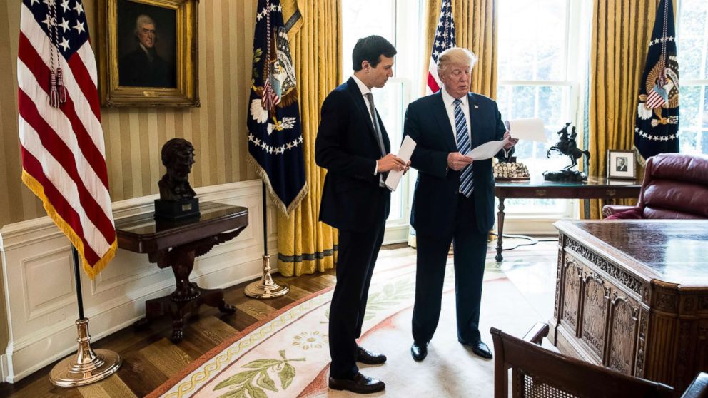 President Donald Trump speaks to White House Senior Adviser Jared Kushner, left, in the Oval Office in Washington, D.C., April 21, 2017. 