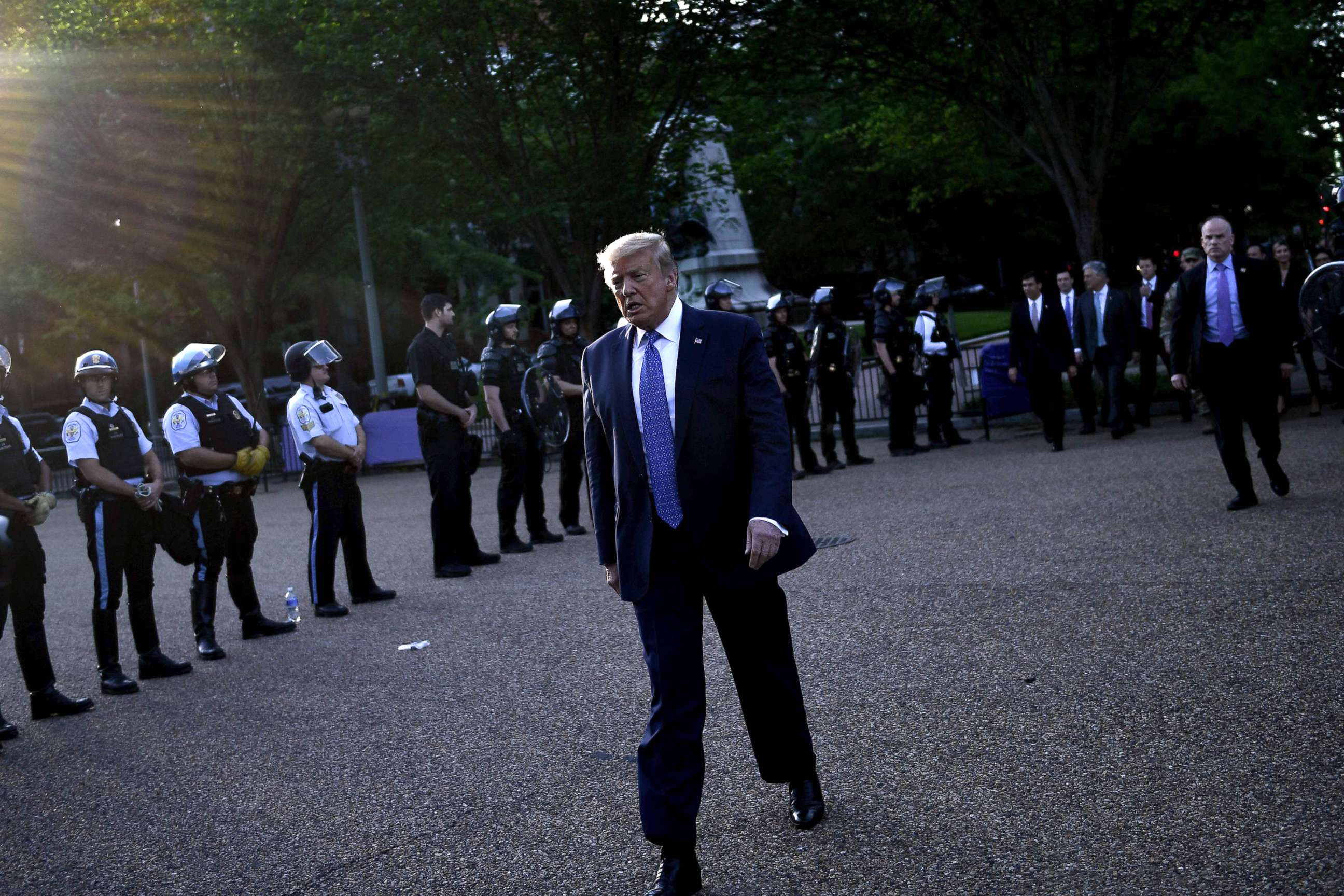 PHOTO: President Donald Trump walks back to the White House escorted by the Secret Service after appearing outside of St John's Episcopal church across Lafayette Park in Washington, D.C. on June 1, 2020.