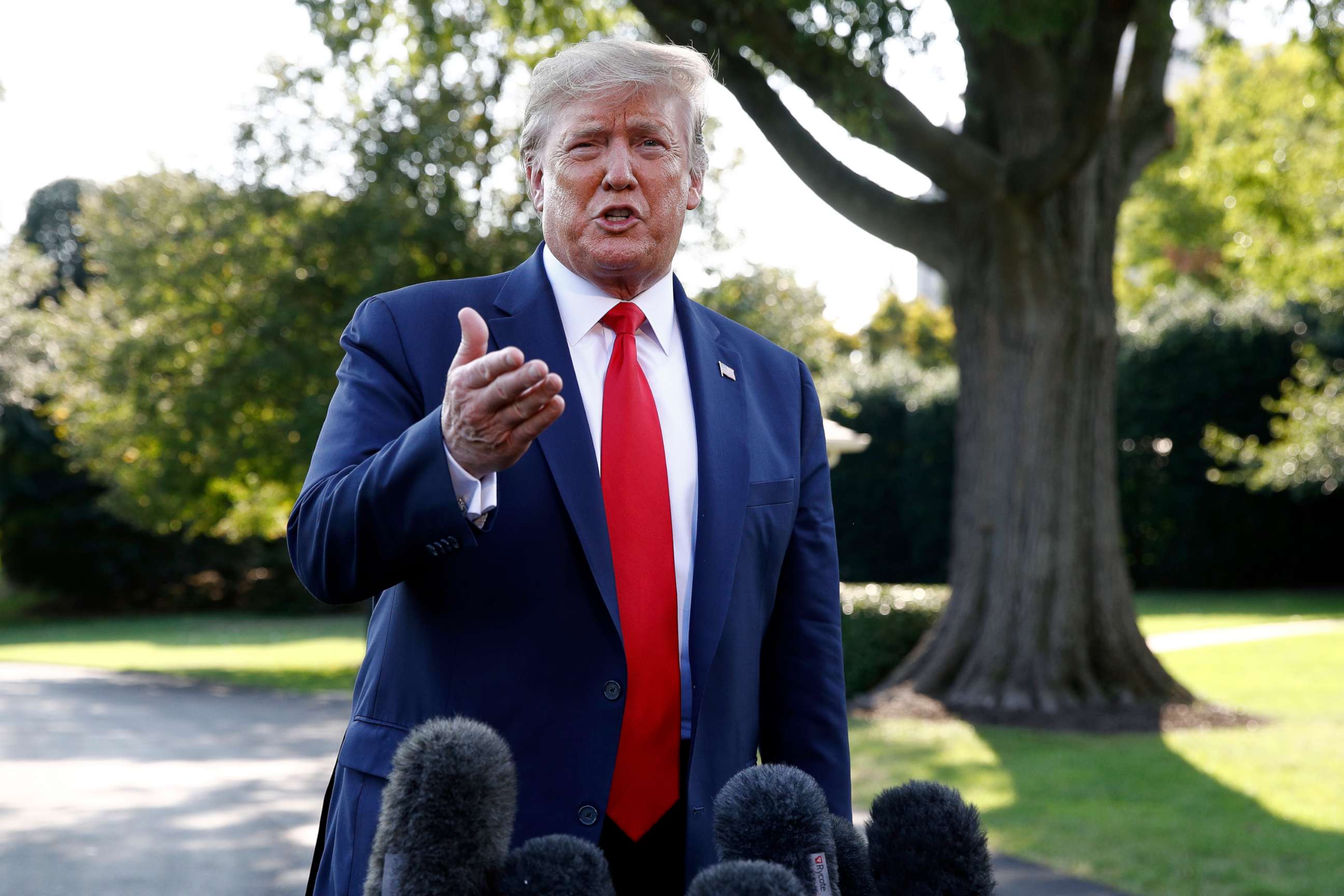 PHOTO: President Donald Trump speaks with reporters before departing on Marine One from the South Lawn of the White House, Sept. 16, 2019. 