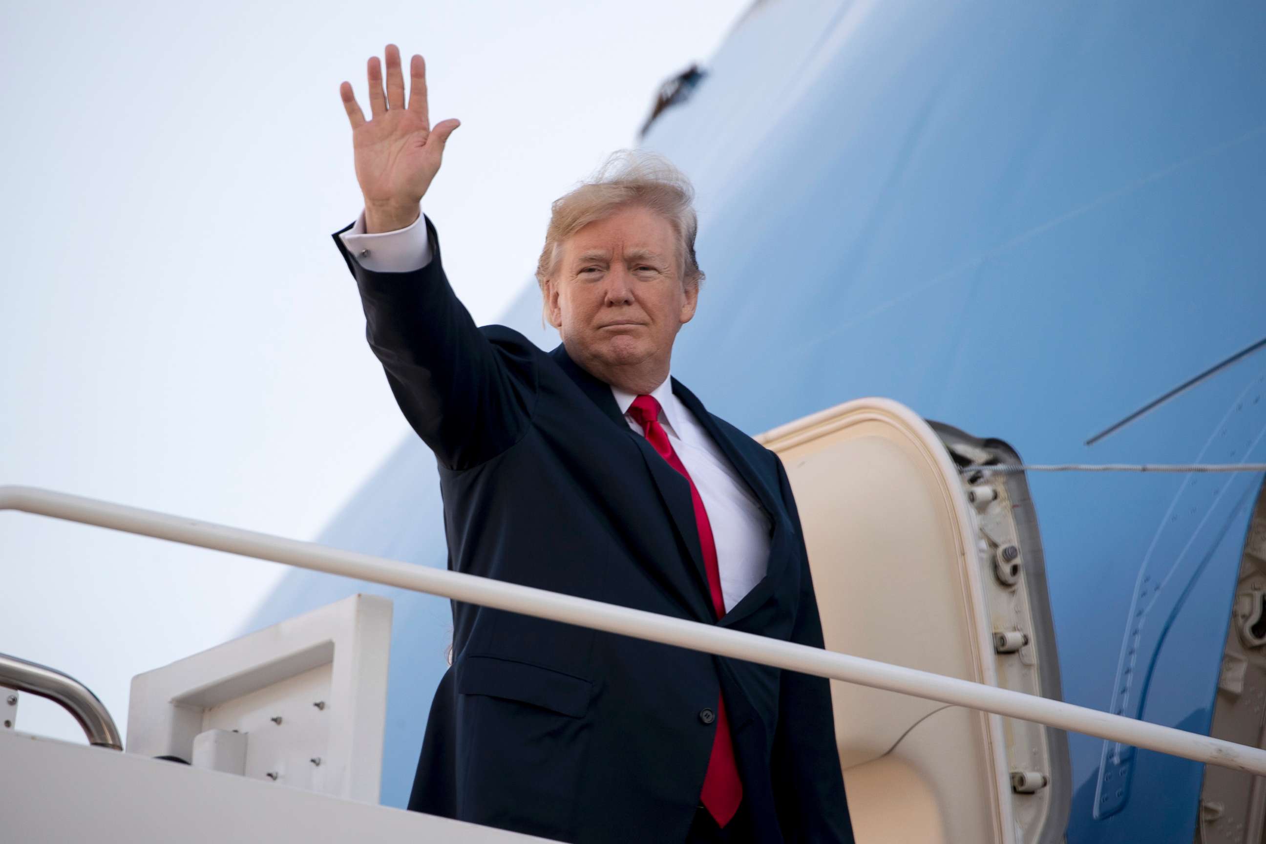 PHOTO: President Donald Trump waves as he boards Air Force One at Andrews Air Force Base, Md., Nov. 3, 2017, to travel to Hawaii, the first stop on a five country trip through Asia.