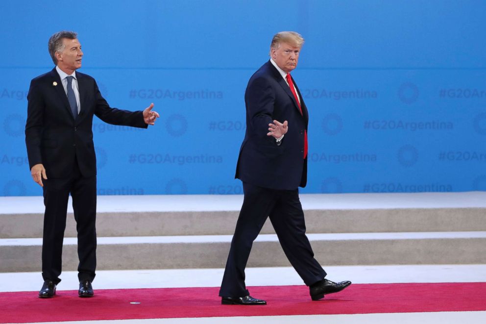 PHOTO: President Donald Trump walks away from Argentina's President Mauricio Macri, left, at the start of the G20 summit in Buenos Aires, Argentina, Nov. 30, 2018.