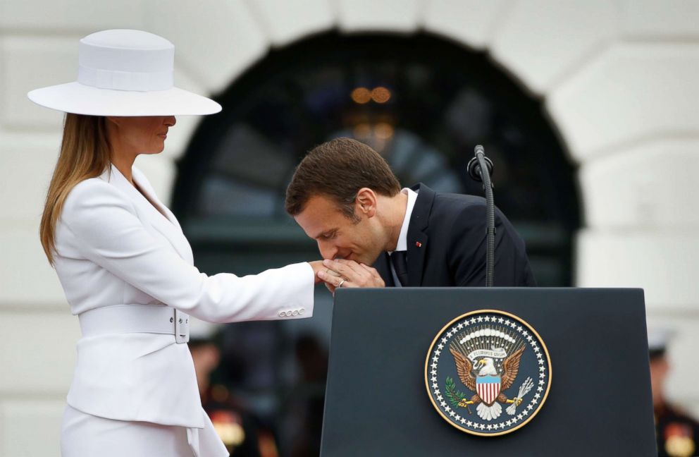 PHOTO: French President Emmanuel Macron kisses first lady Melania Trump during an arrival ceremony at the White House, April 24, 2018.