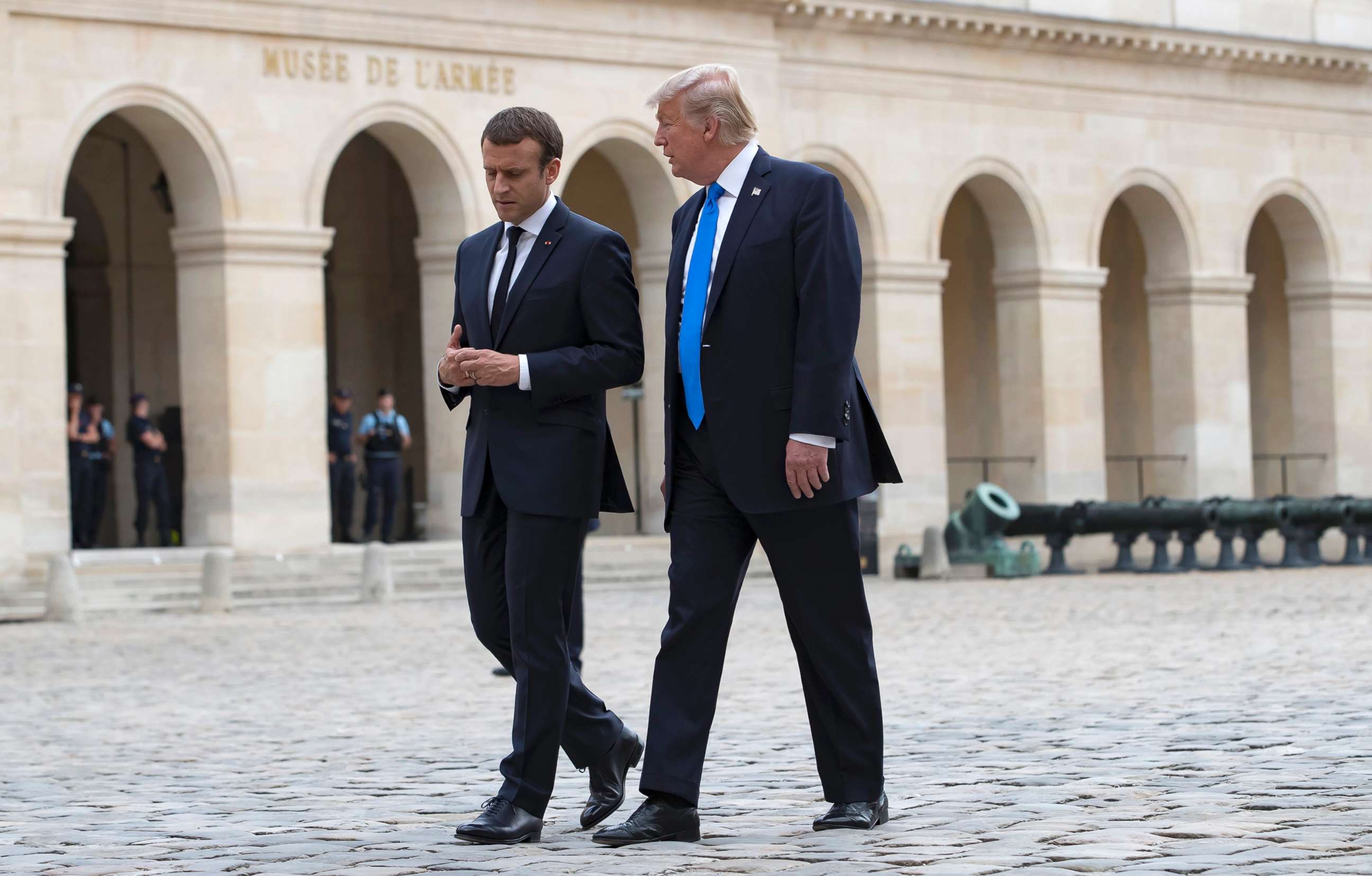 PHOTO: French President Emmanuel Macron walks with President Donald J. Trump as they leave Les Invalides museum in Paris, July 13, 2017. President Donald Trump is on a two-day visit in Paris. 