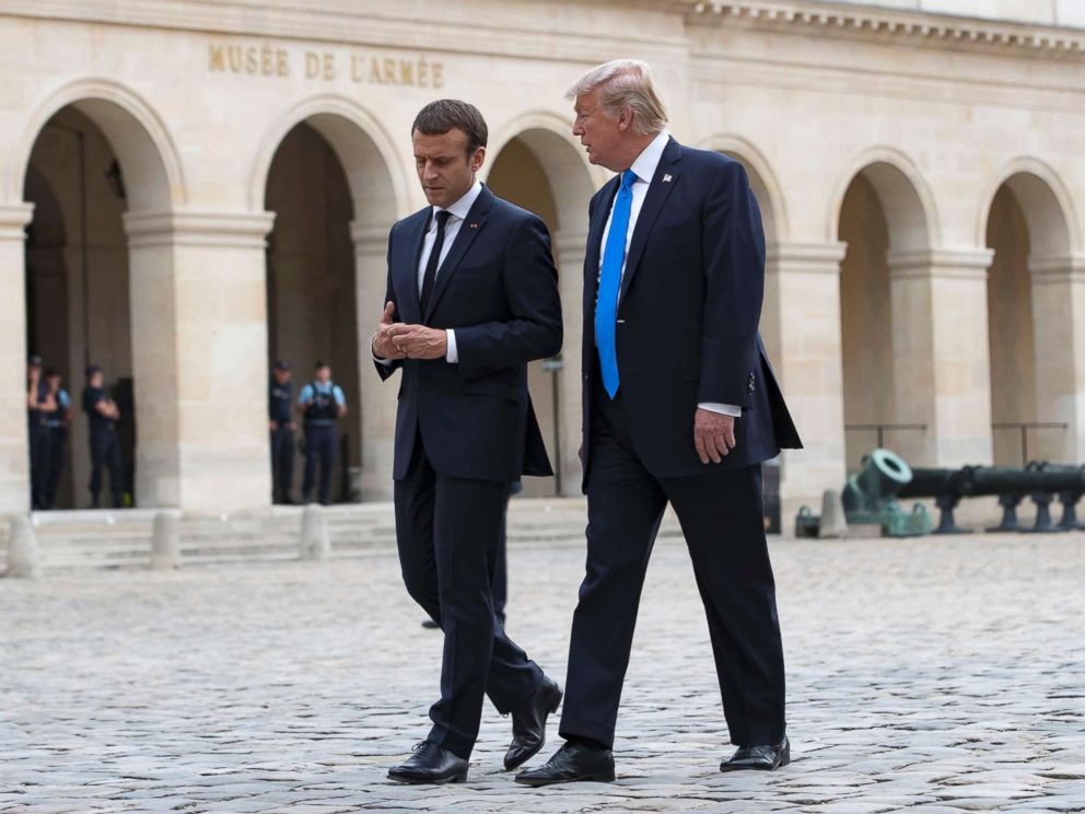 PHOTO: French President Emmanuel Macron walks with President Donald J. Trump as they leave Les Invalides museum in Paris, July 13, 2017. President Donald Trump is on a two-day visit in Paris.