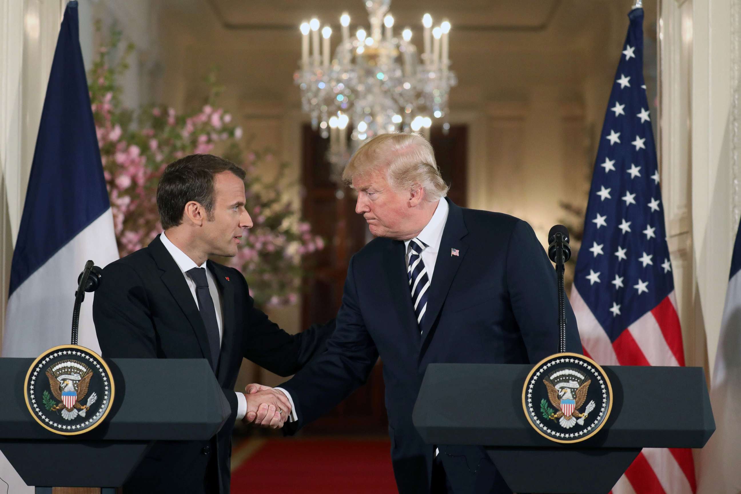 PHOTO: US President Donald Trump and French President Emmanuel Macron shake hands before holding a joint press conference at the White House in Washington, DC, on April 24, 2018. 