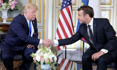 PHOTO: President Donald Trump and French President Emmanuel Macron shake hands during a meeting in Normandy, France, June 6, 2019.