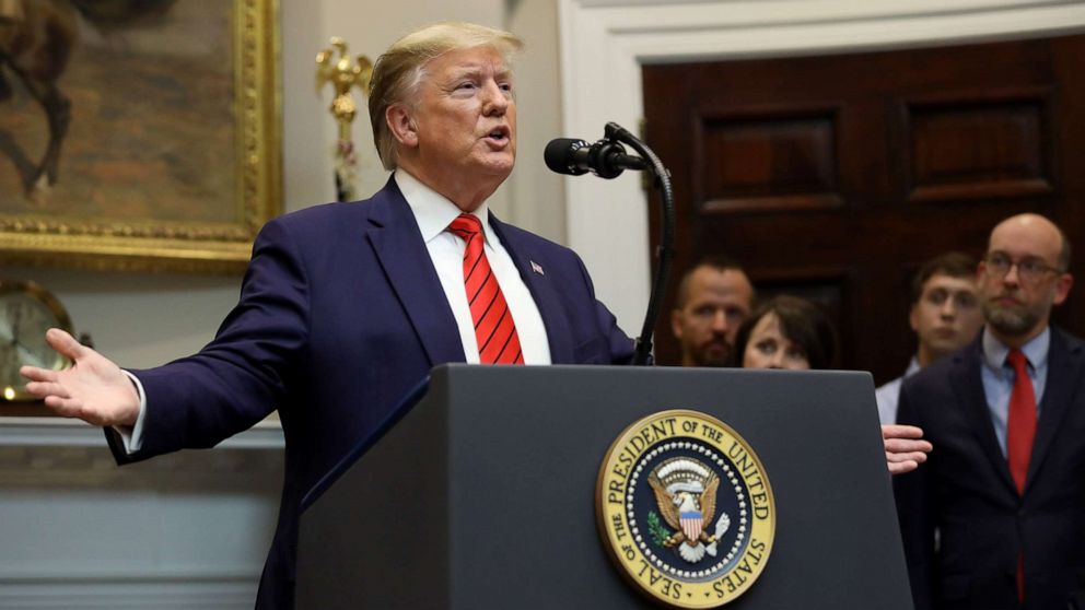 PHOTO: U.S. President Donald Trump responds to a question from a reporter at an event for the signing of two executive orders aimed at greater governmental transparency at the White House Oct. 9, 2019 in Washington, D.C.