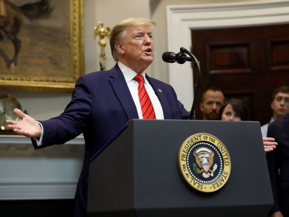 PHOTO: U.S. President Donald Trump responds to a question from a reporter at an event for the signing of two executive orders aimed at greater governmental transparency at the White House Oct. 9, 2019 in Washington, D.C.