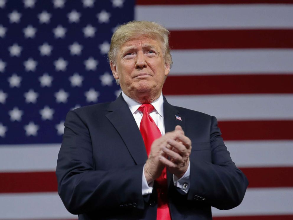 PHOTO: President Donald Trump applauds as he take the stage to speak at a campaign rally at Kansas Expocentre, Oct. 6, 2018 in Topeka, Kan.