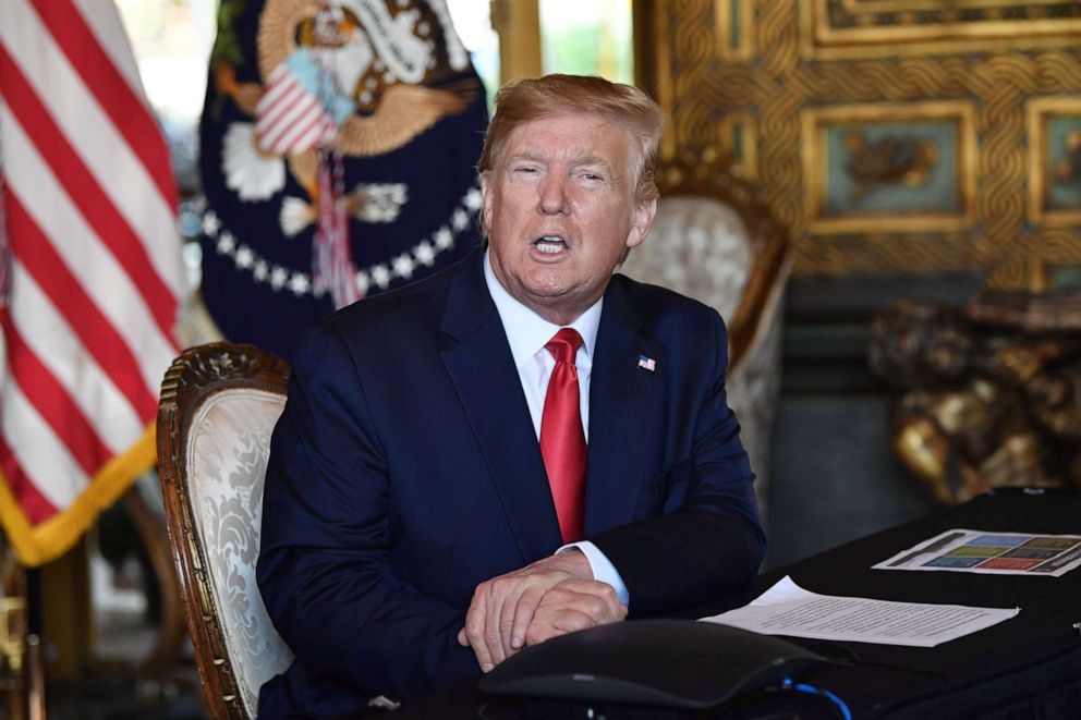 PHOTO: President Donald Trump answers questions from reporters at the Mar-a-Lago estate in Palm Beach, Fla., Dec. 24, 2019.