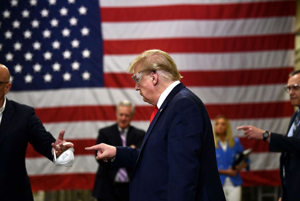 PHOTO: President Donald Trump points during a tour of a Honeywell International plant that manufactures personal protective equipment in Phoenix, May 5, 2020.