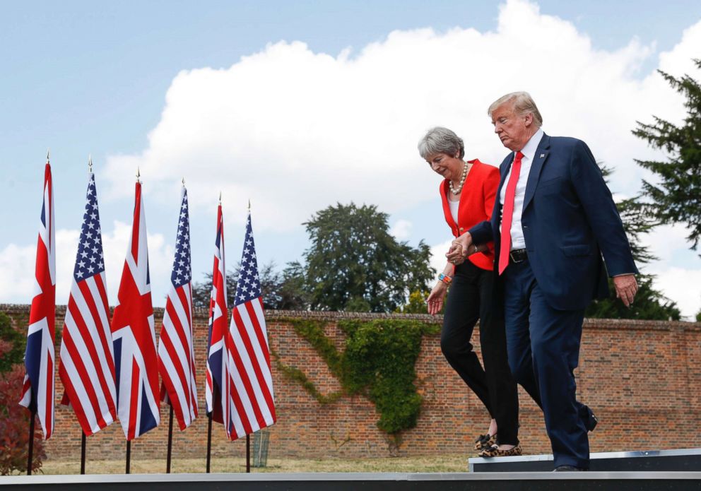 PHOTO: President Donald Trump and British Prime Minister Theresa May hold hands at the conclusion of their joint news conference at Chequers, in Buckinghamshire, England, July 13, 2018.