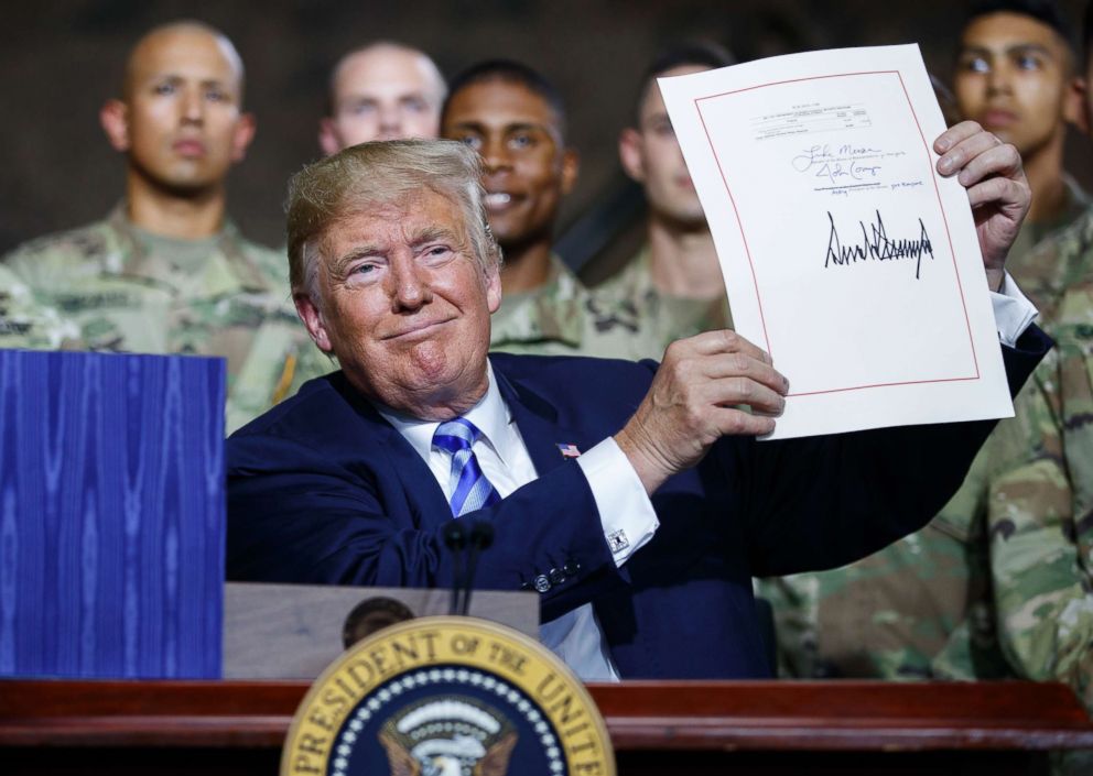 PHOTO: President Donald Trump during a signing ceremony for a $716 billion defense policy bill named for Sen. John McCain, Aug. 13, 2018, in Fort Drum, N.Y. 