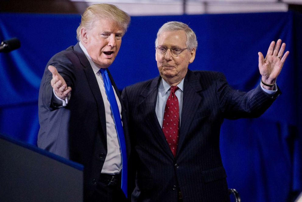 PHOTO: President Donald Trump invites Senate Majority Leader Mitch McConnell, right, onstage as he speaks at a rally at Alumni Coliseum in Richmond, Ky., Oct. 13, 2018.