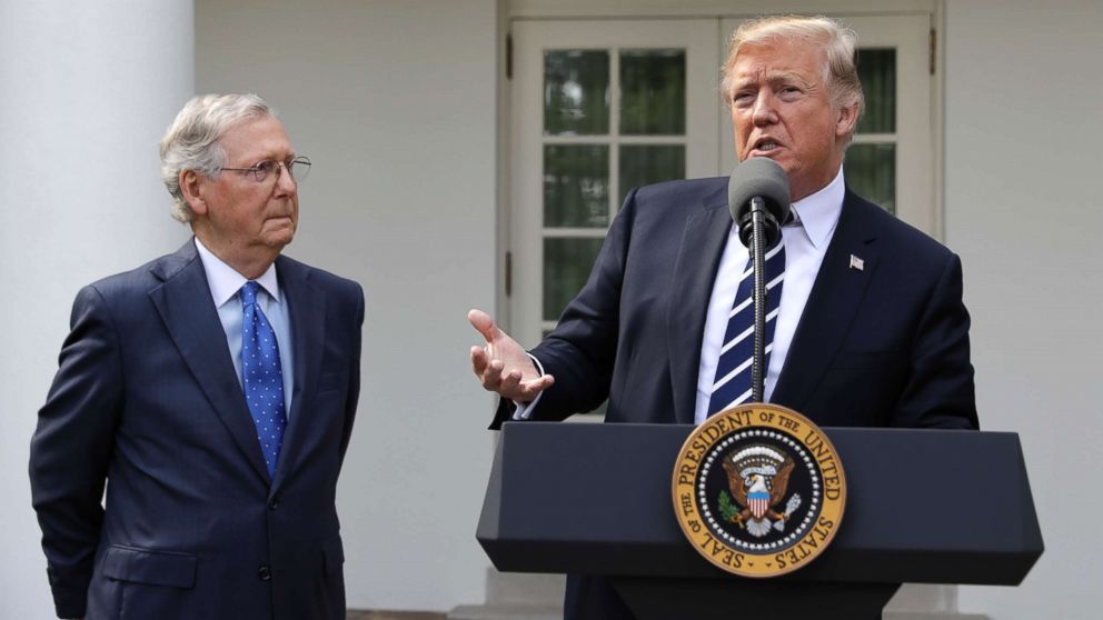 President Donald Trump speaks with Senate Majority Leader Mitch McConnell in the Rose Garden at the White House, Oct. 16, 2017. 