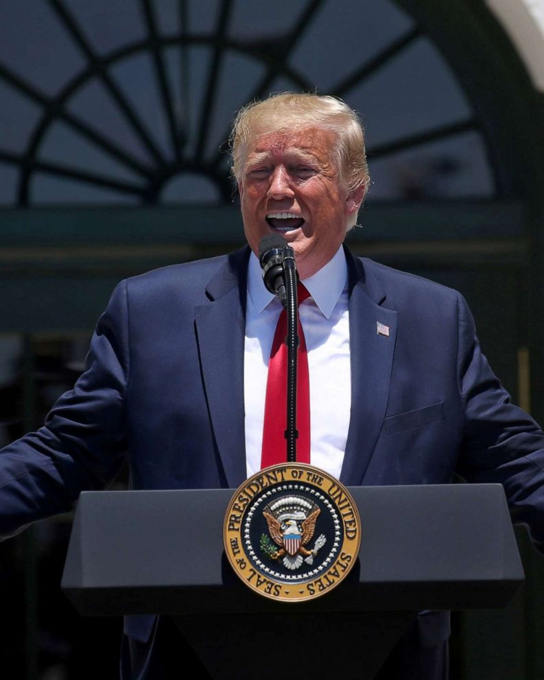 PHOTO: President Donald Trump answers questions from the media during an event on the South Lawn of the White House, July 15, 2019.