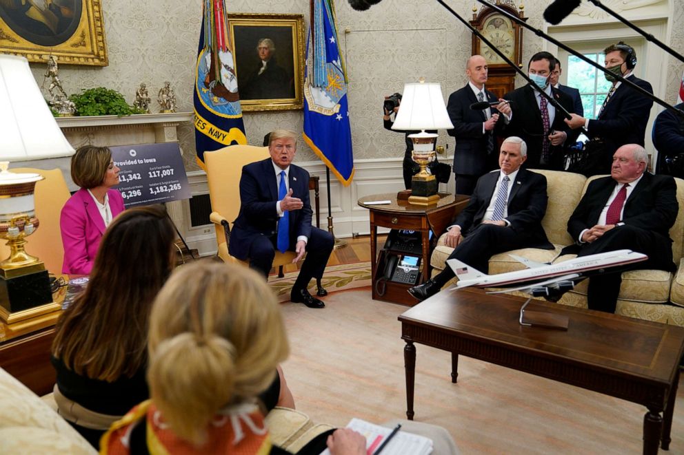 PHOTO: President Donald Trump speaks during a meeting with Gov. Kim Reynolds (R-Iowa) in the Oval Office of the White House in Washington, D.C., on May 6, 2020. Agriculture Secretary Sonny Perdue (right seated) and Vice President Mike Pence listen.
