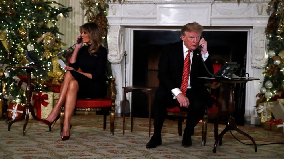 PHOTO: President Donald Trump and first lady Melania Trump each speak on the phone sharing updates to track Santa's movements from the North American Aerospace Defense Command (NORAD) Santa Tracker on Christmas Eve, Monday, Dec. 24, 2018. 