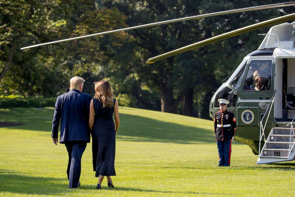 PHOTO: President Donald Trump and first lady Melania Trump walk across the South Lawn, Aug. 7, 2019, to board Marine One for a trip to Dayton, Ohio, and El Paso, Texas.