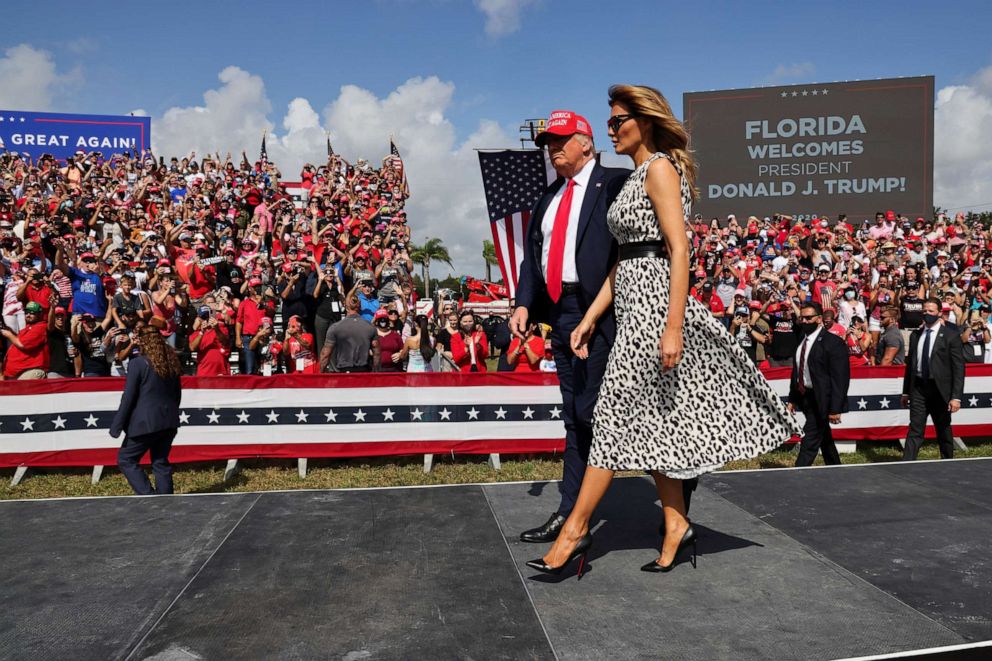 PHOTO: President Donald Trump walks with first lady Melania Trump during his campaign rally outside Raymond James Stadium, in Tampa, Fla., Oct. 29, 2020. 