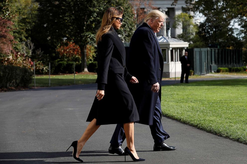 PHOTO: President Donald Trump and first lady Melania Trump walk across the South Lawn of the White House, Nov. 9, 2019.