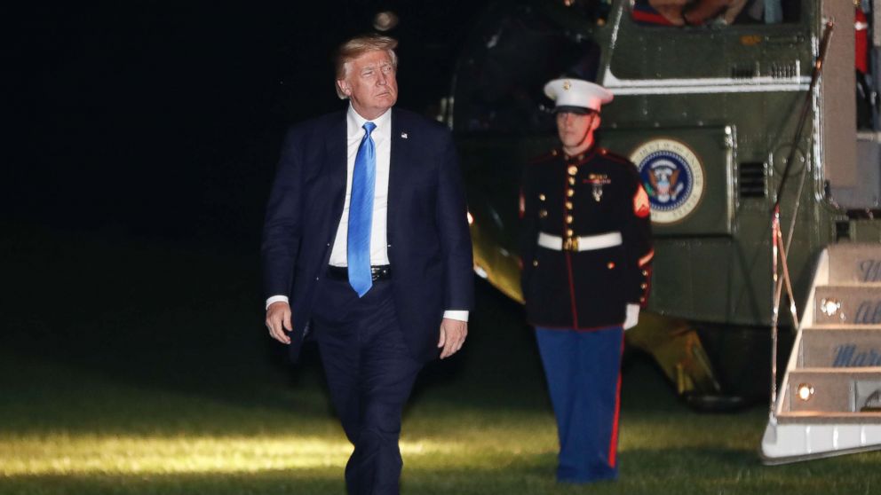 President Donald Trump walks across the South Lawn of the White House, Oct. 25, 2017, following his return on Marine One.
