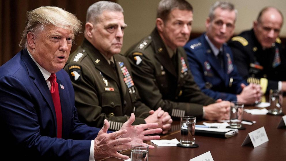 PHOTO: President Donald Trump speaks during a meeting with senior military leaders including Chairman of the Joint Chiefs of Staff Army General Mark A. Milley, seated next to Trump, in the Cabinet Room of the White House Oct. 7, 2019.