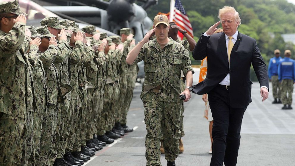 PHOTO: In this file photo, President Donald Trump salutes troops aboard the USS Wasp in Yokosuka, south of Tokyo, on May 28, 2019.